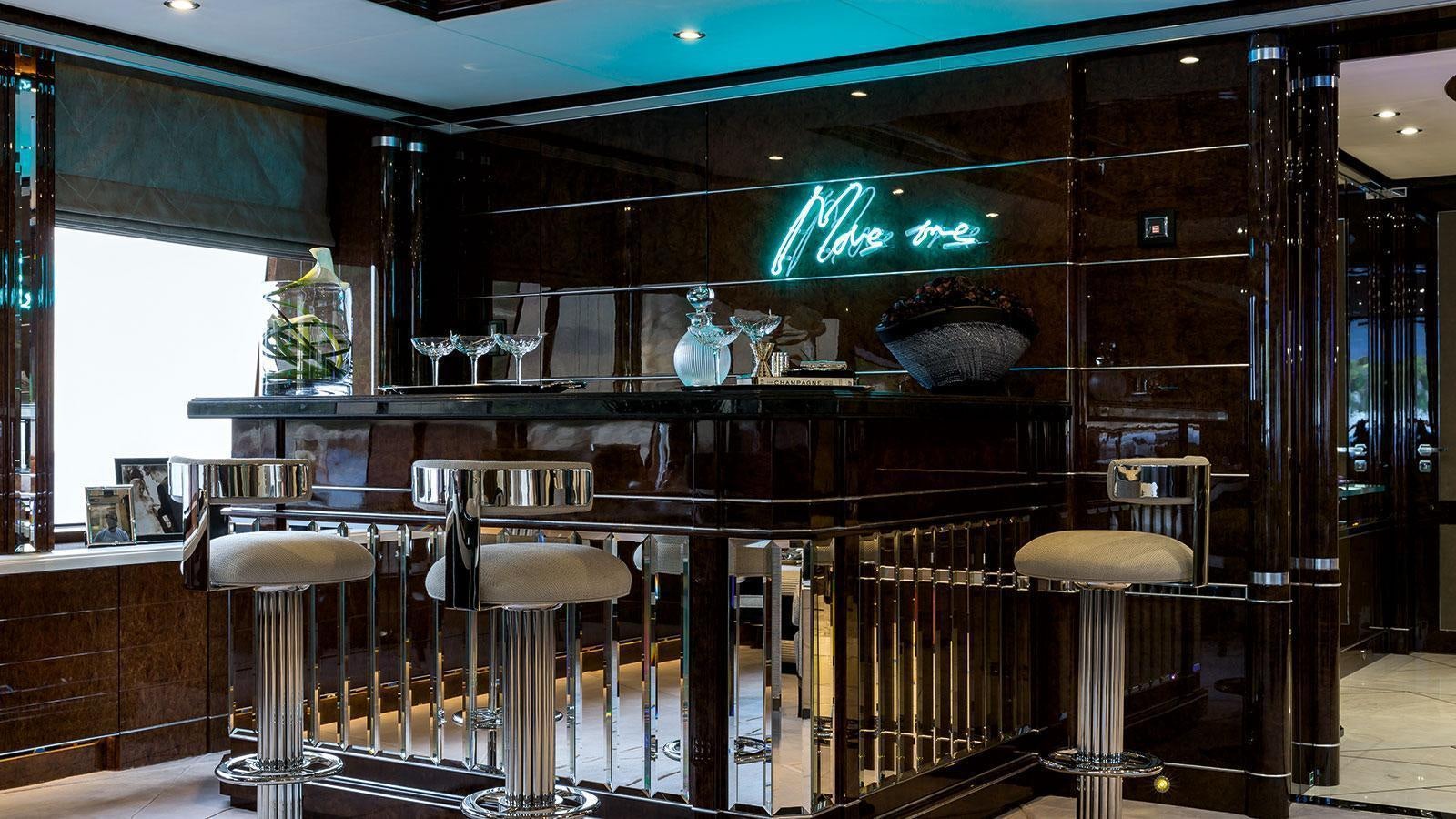 a bar with stools and stools aboard SOUNDWAVE Yacht for Charter