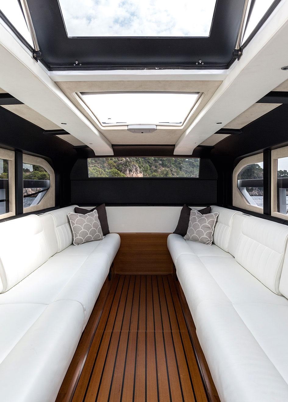 a boat with pillows on a deck aboard SOUNDWAVE Yacht for Charter