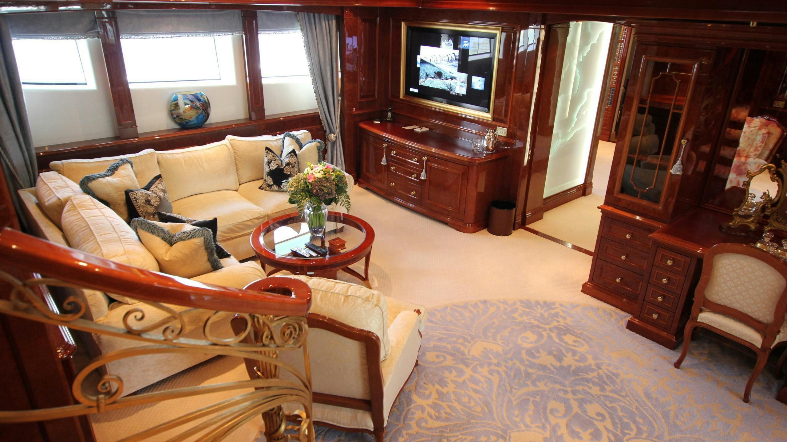 a living room with a couch and a television aboard ST DAVID Yacht for Charter