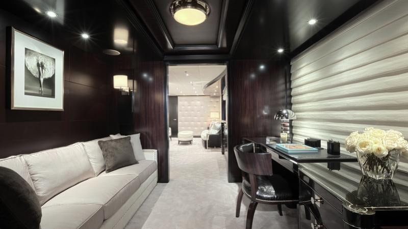 a room with a couch and a table and a chair aboard CARPE DIEM Yacht for Charter