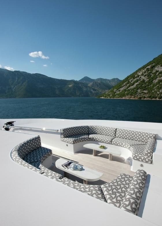 a patio with a table and chairs aboard CARPE DIEM Yacht for Charter