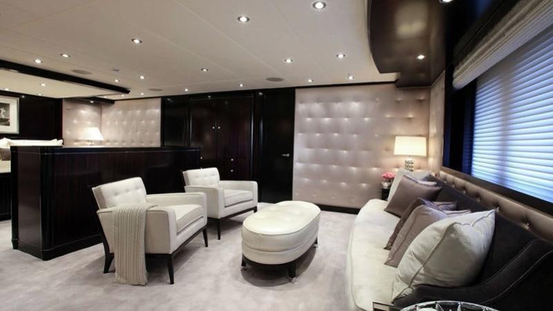 a room with a couch and a table and chairs aboard CARPE DIEM Yacht for Charter