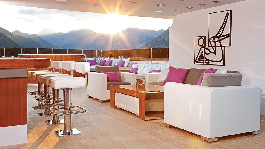 a room with a couch and a table aboard CARPE DIEM Yacht for Charter