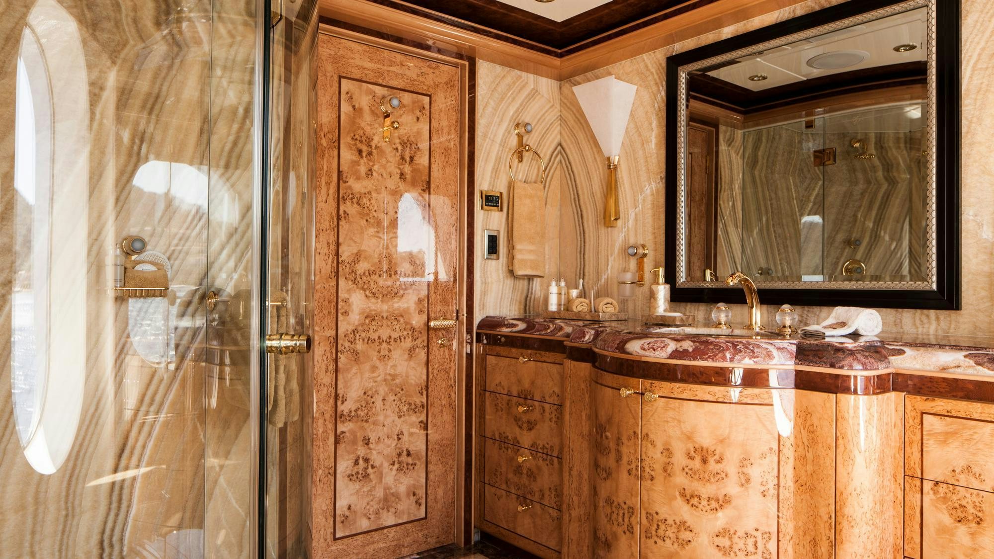 a bathroom with a sink and a mirror aboard LIBERTY Yacht for Charter