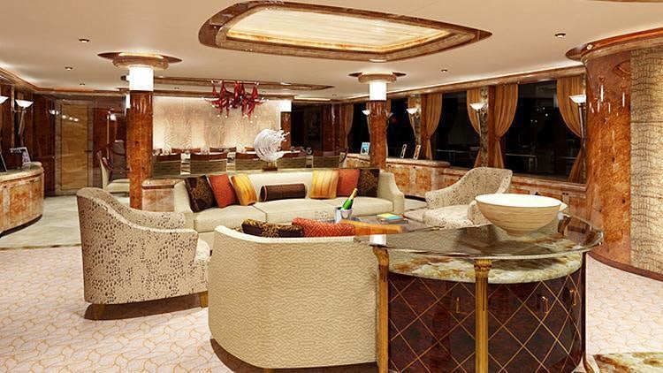 a living room with a large table and chairs aboard LIBERTY Yacht for Charter