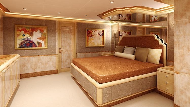 a bed in a room aboard LIBERTY Yacht for Charter