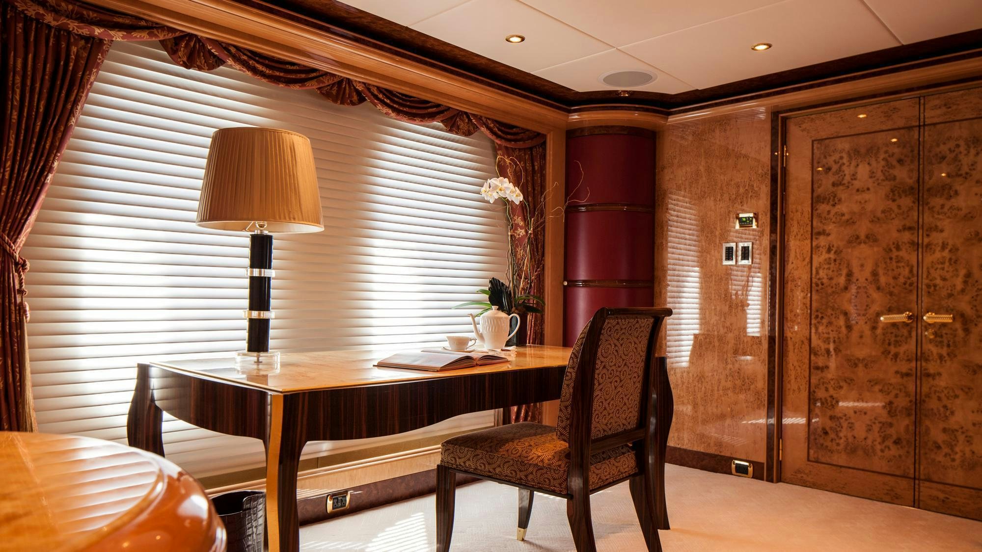 a room with a table and chairs aboard LIBERTY Yacht for Charter