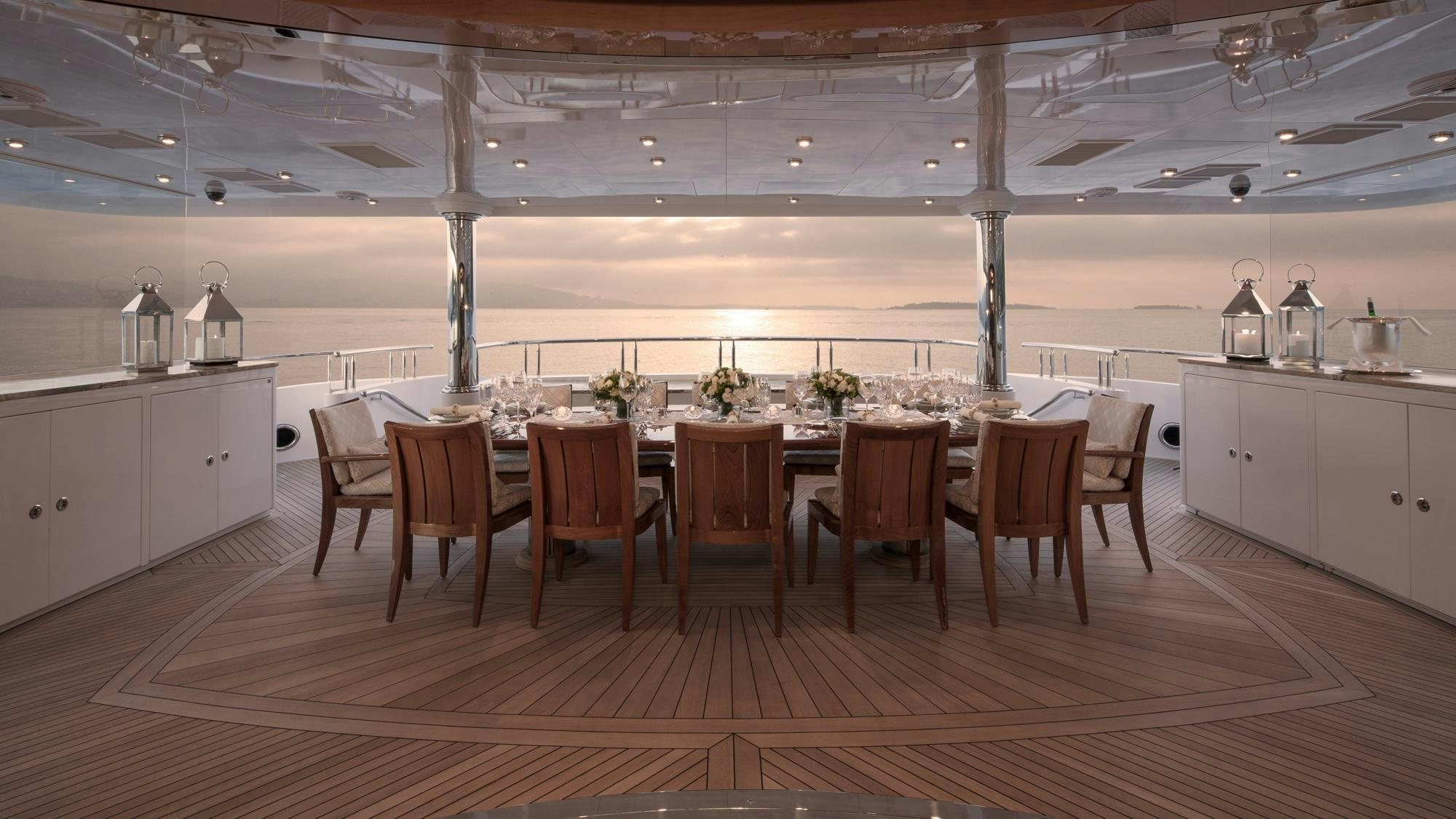 a kitchen with a table and chairs aboard LIBERTY Yacht for Charter