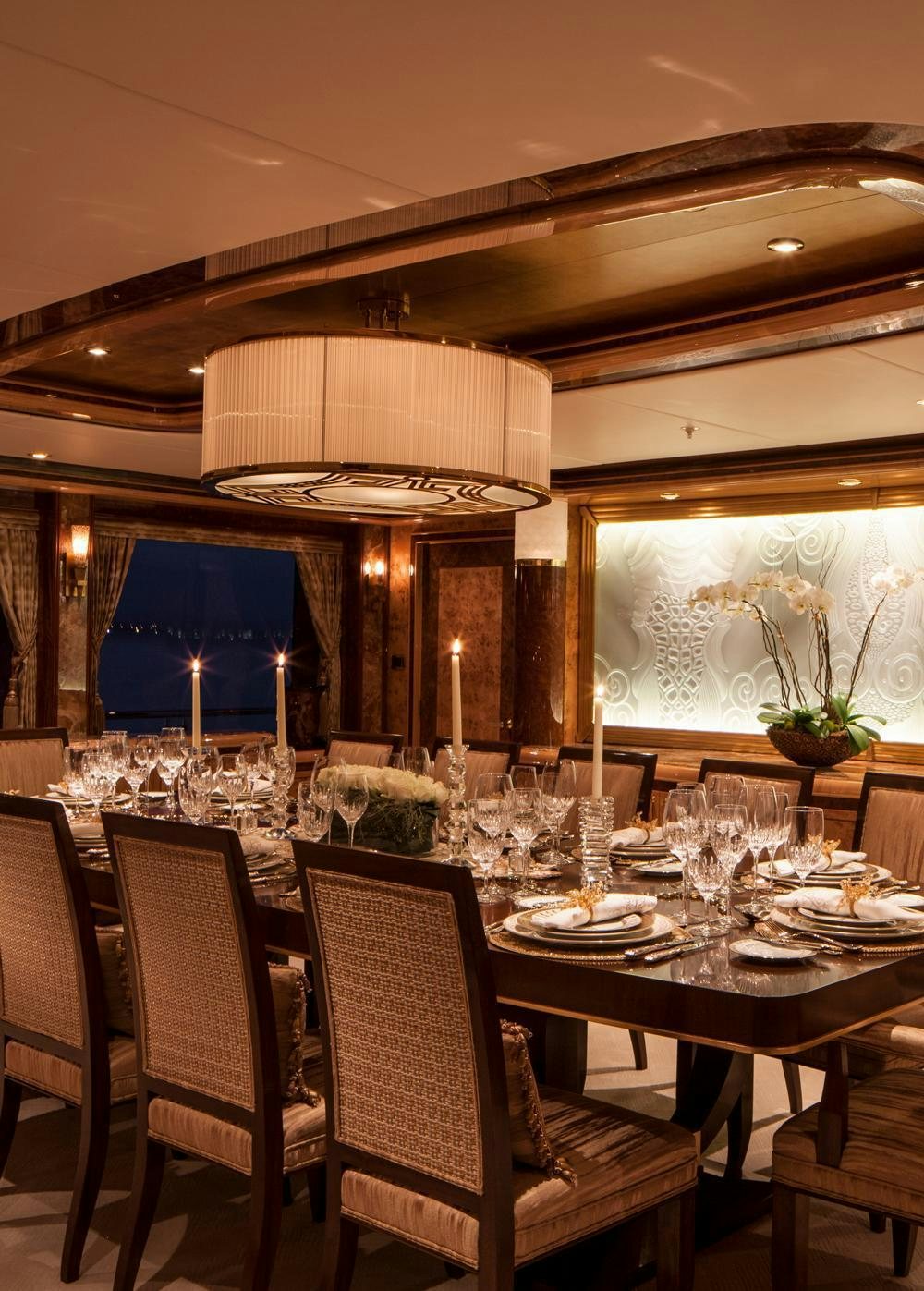 a dining room with a table set aboard LIBERTY Yacht for Charter