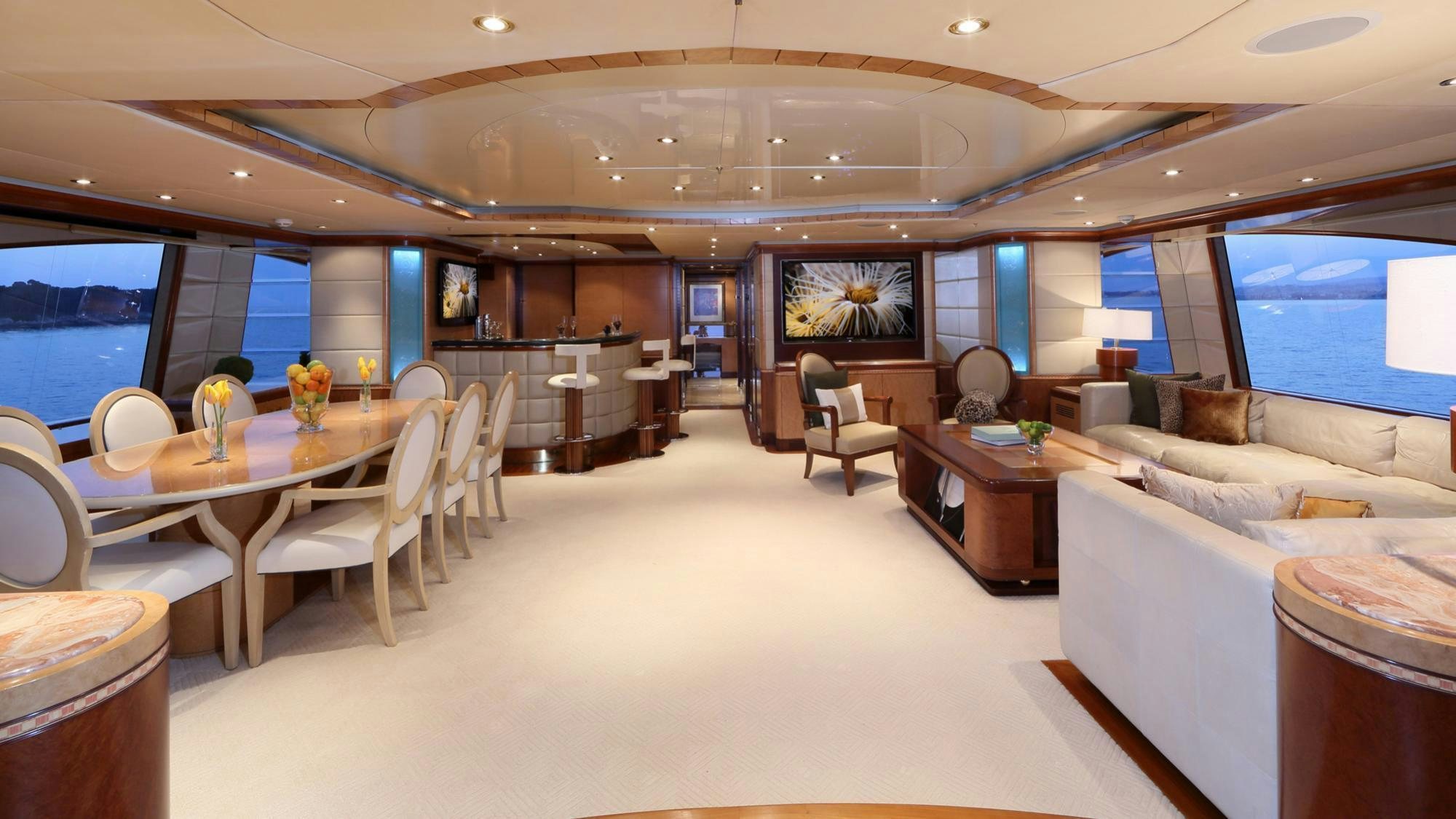 a room with a table and chairs aboard JAGUAR Yacht for Charter