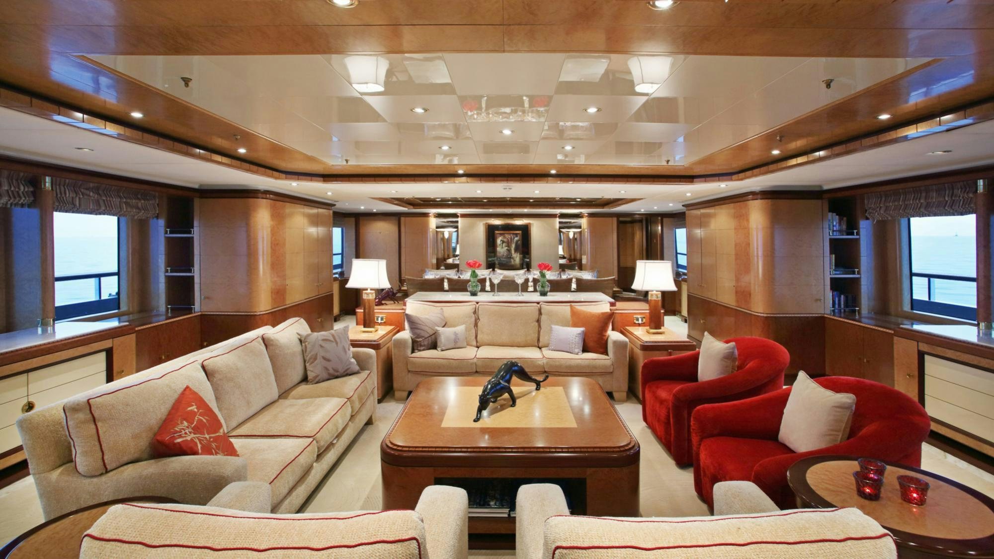 a living room with a couch and a table aboard JAGUAR Yacht for Charter