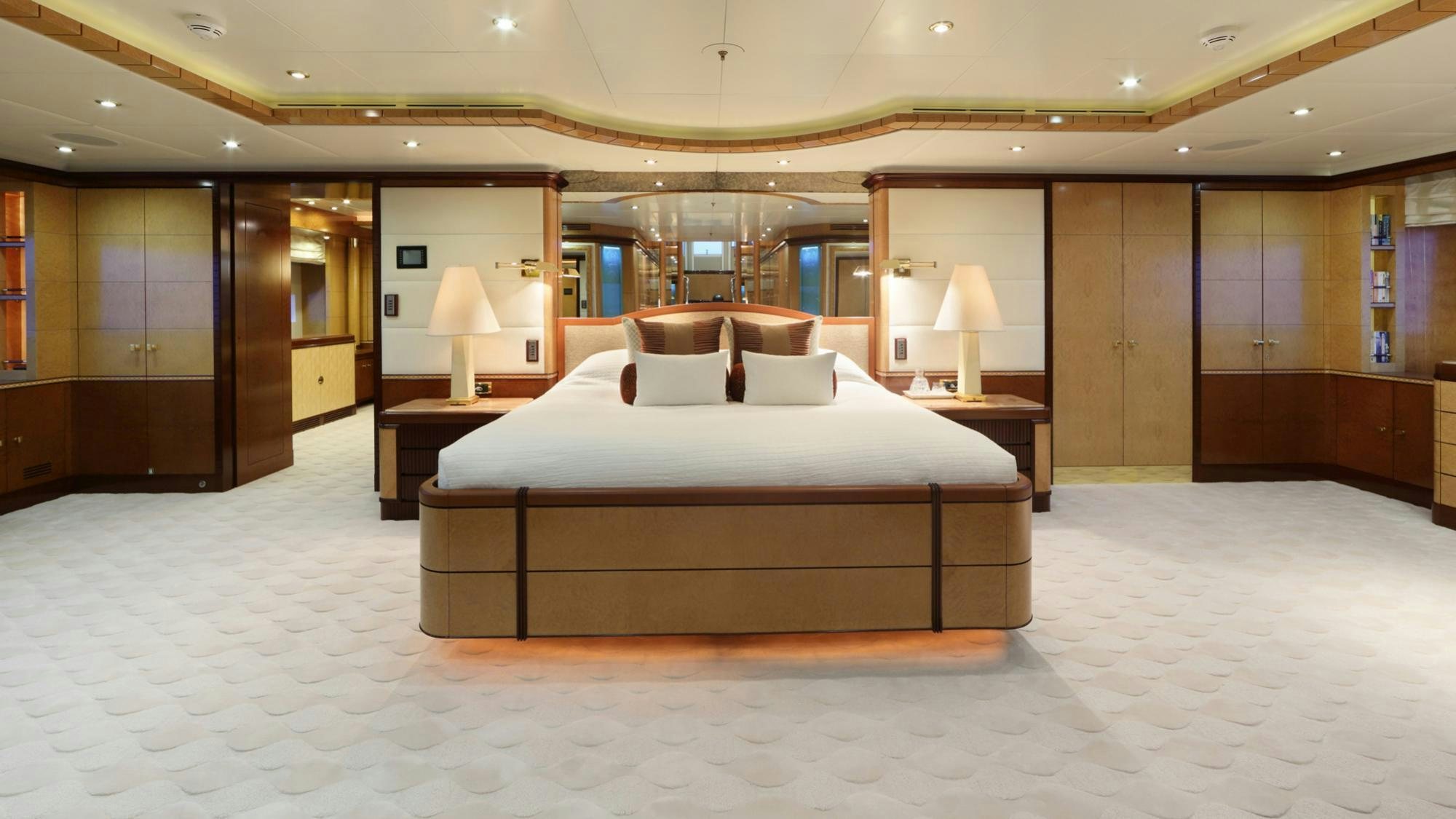 a large hotel room with a large bed aboard JAGUAR Yacht for Charter