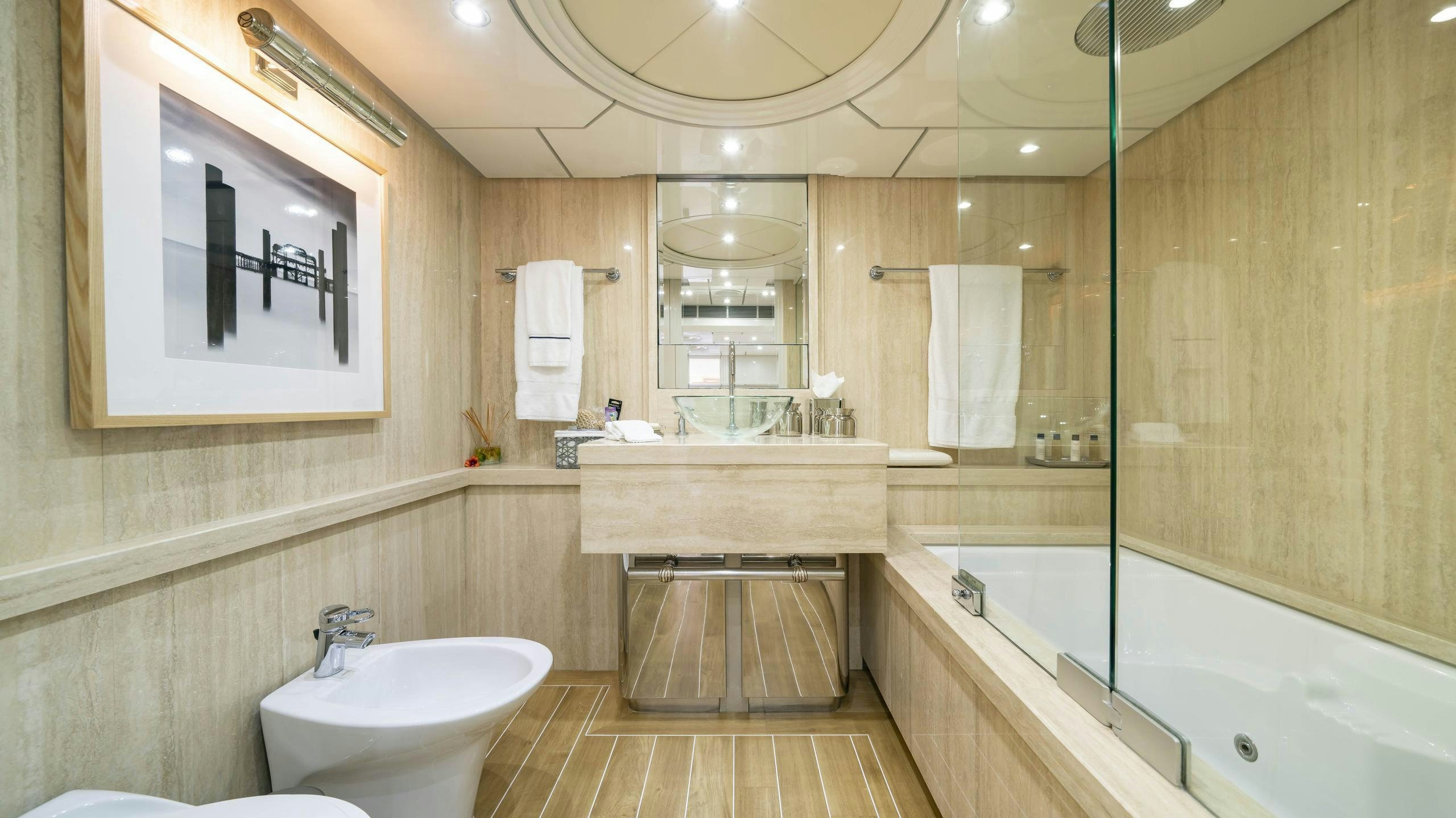 a bathroom with a sink toilet and bathtub aboard OCEANA I Yacht for Charter