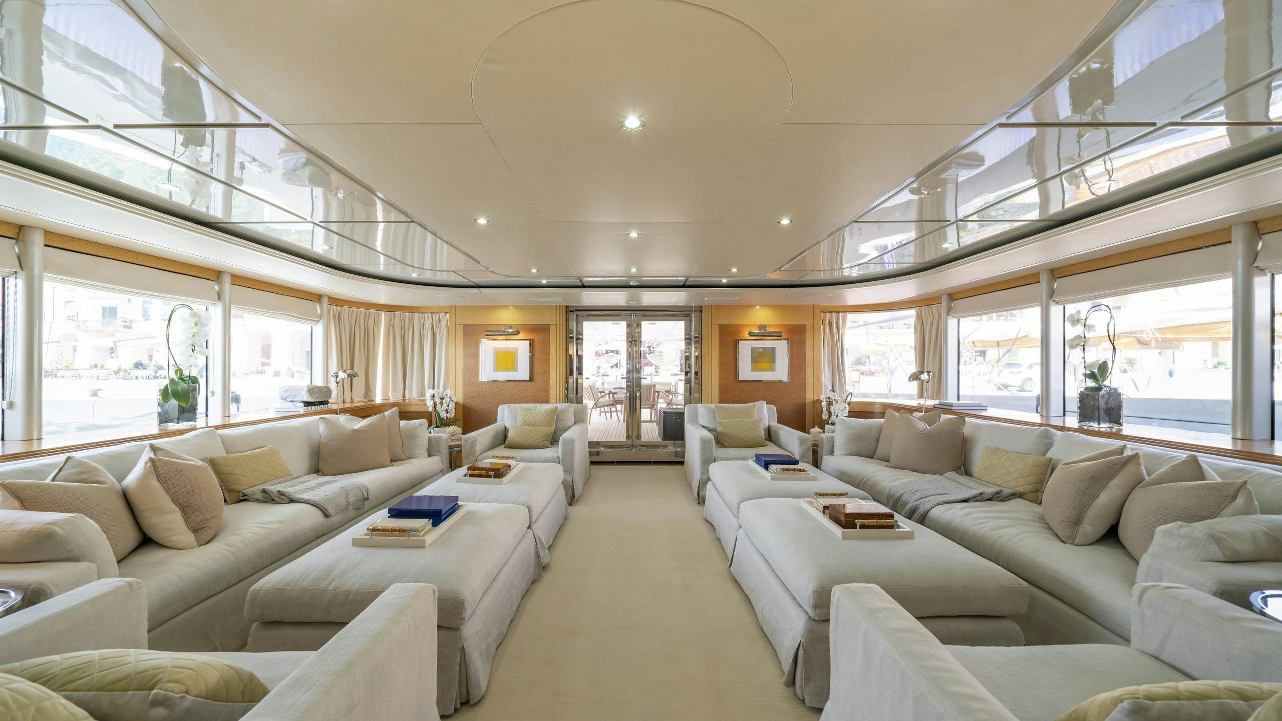 a living room with a large window aboard OCEANA I Yacht for Charter