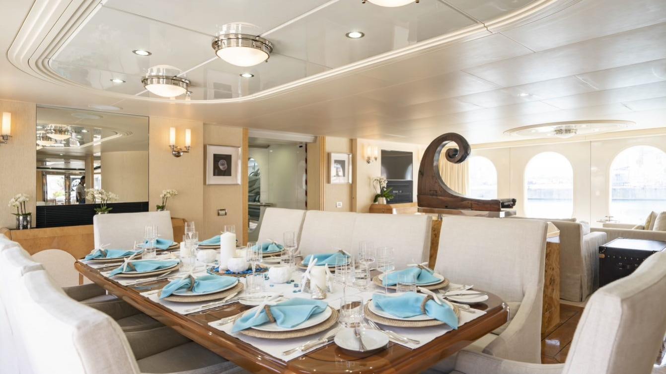 a dining room with a table set aboard OCEANA I Yacht for Charter