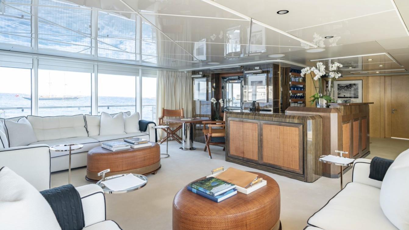 a living room with a couch and a table aboard OCEANA I Yacht for Charter