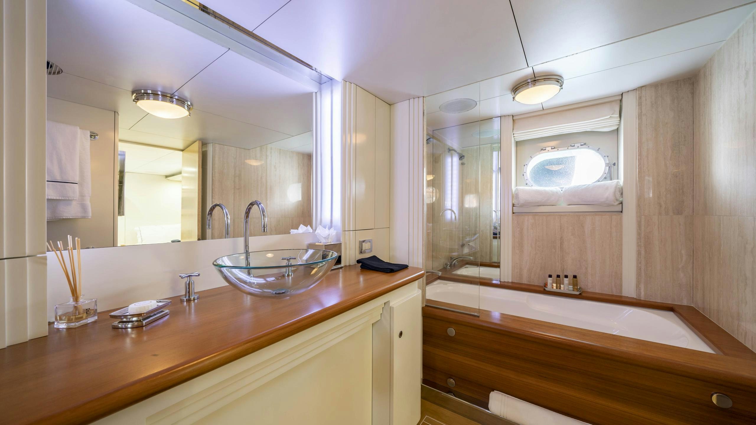 a bathroom with a large mirror aboard OCEANA I Yacht for Charter