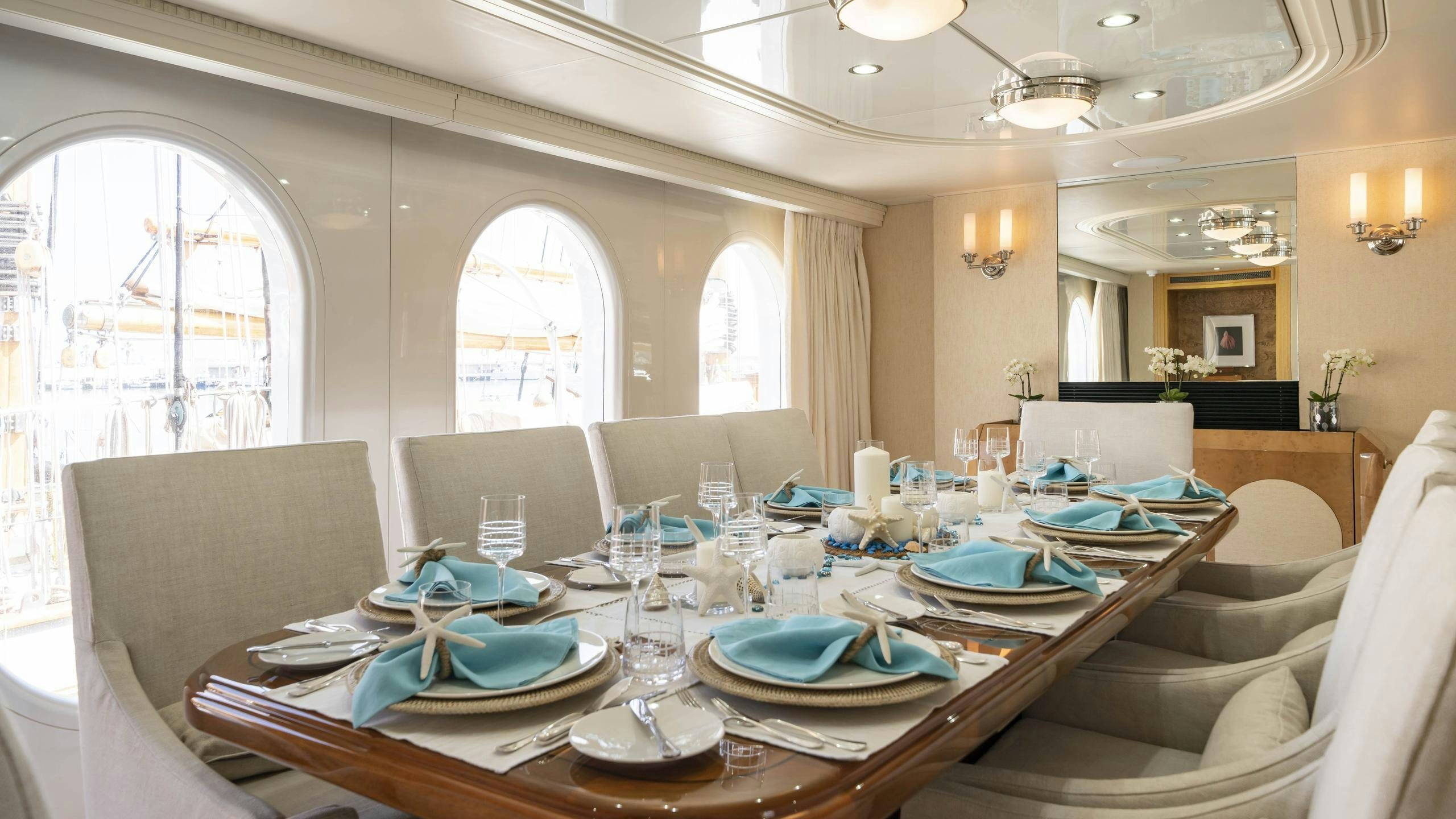 a dining room with a table set aboard OCEANA I Yacht for Charter