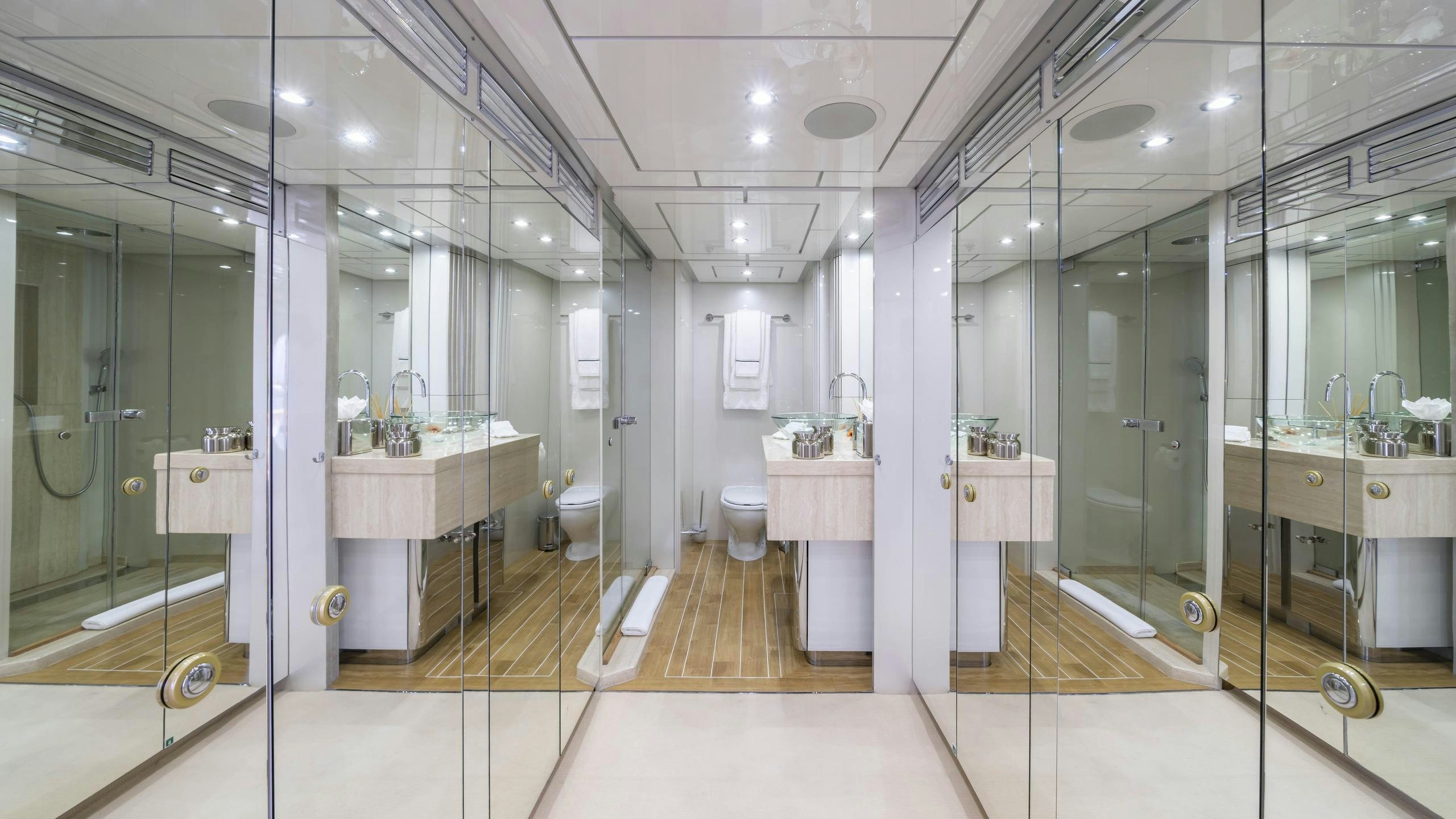 a bathroom with a glass shower aboard OCEANA I Yacht for Charter