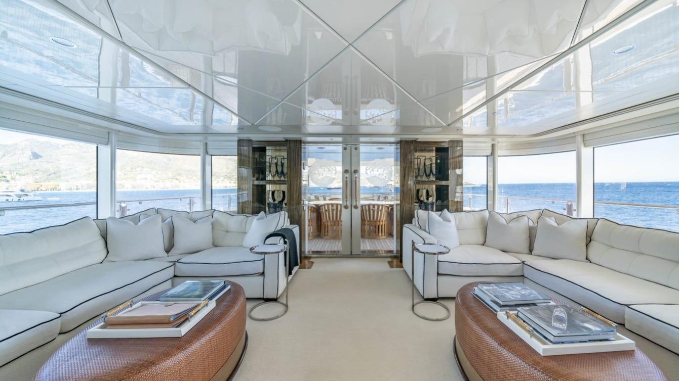 a living room with a large window aboard OCEANA I Yacht for Charter