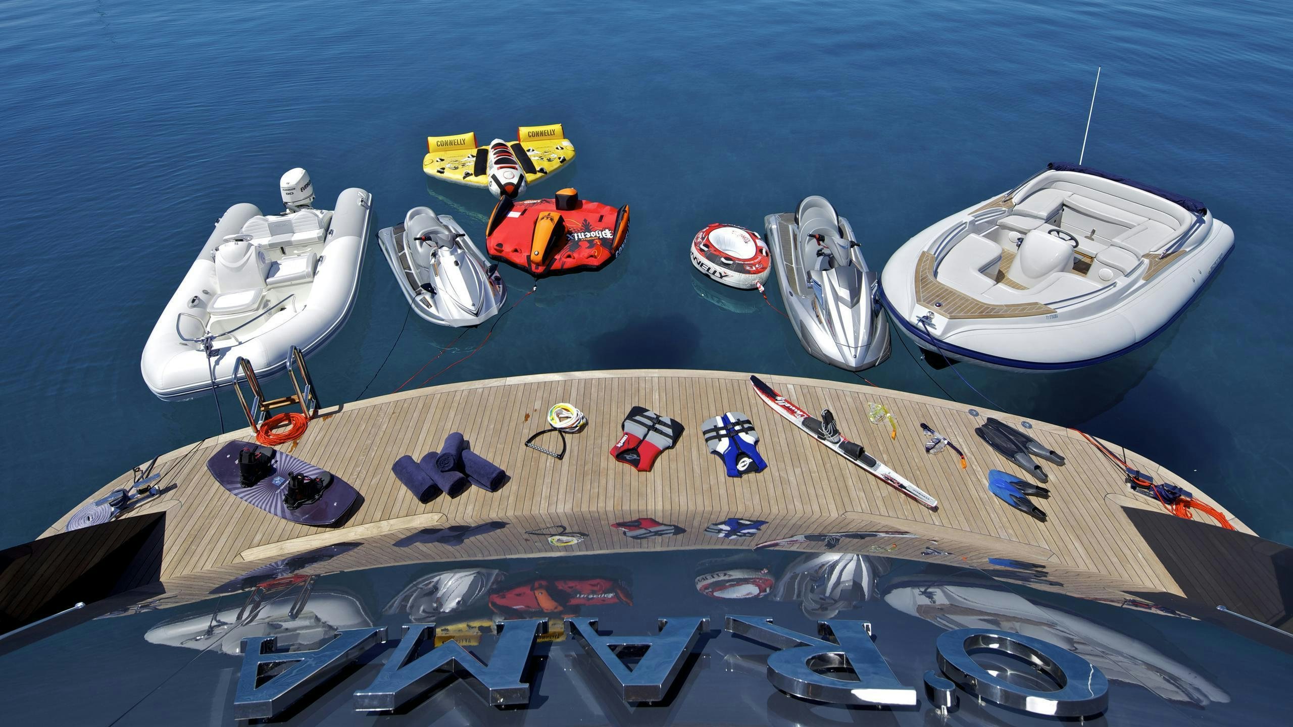 a group of boats on a beach aboard MIA RAMA Yacht for Charter