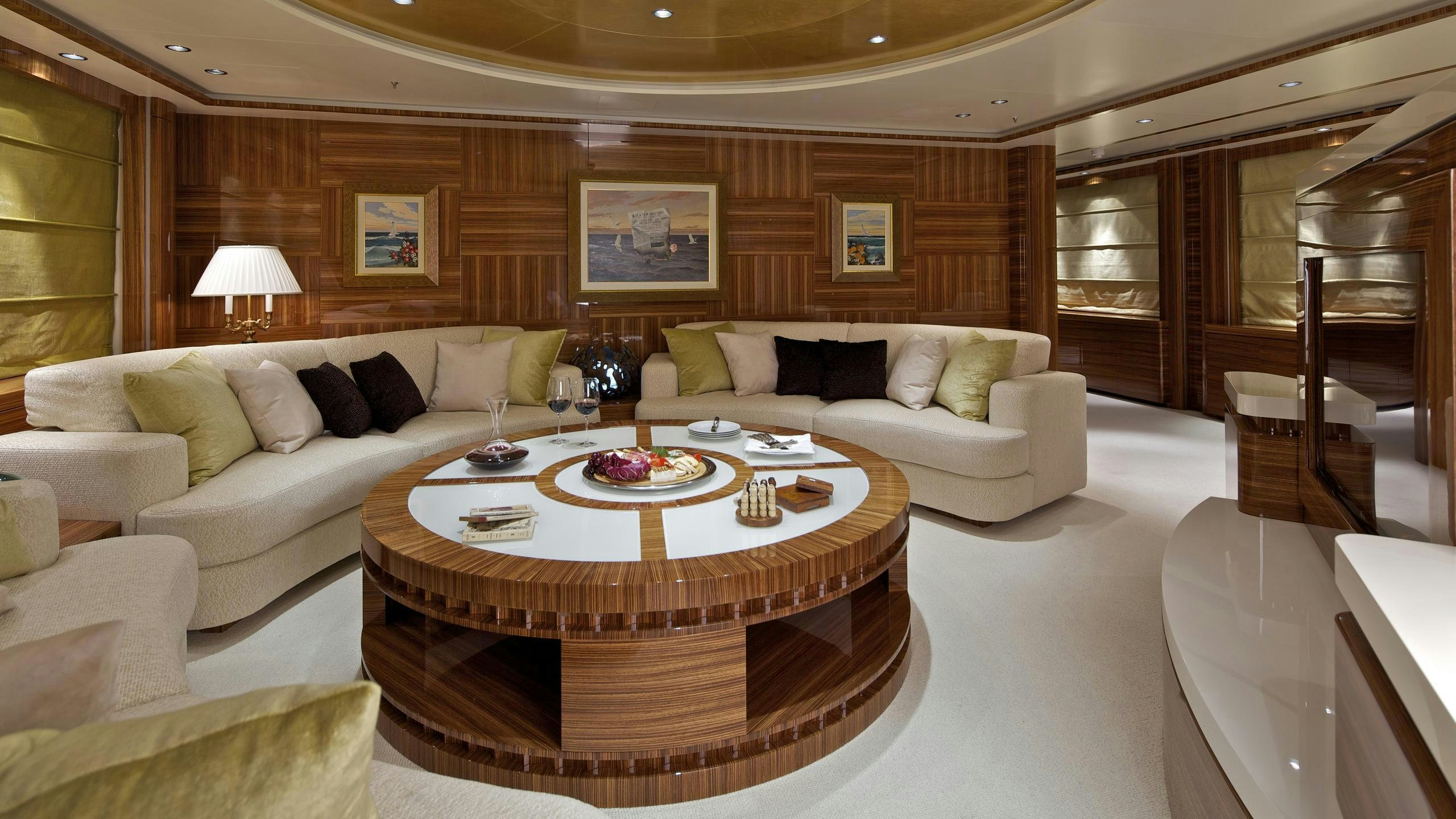 a living room with a couch and a table aboard MIA RAMA Yacht for Charter