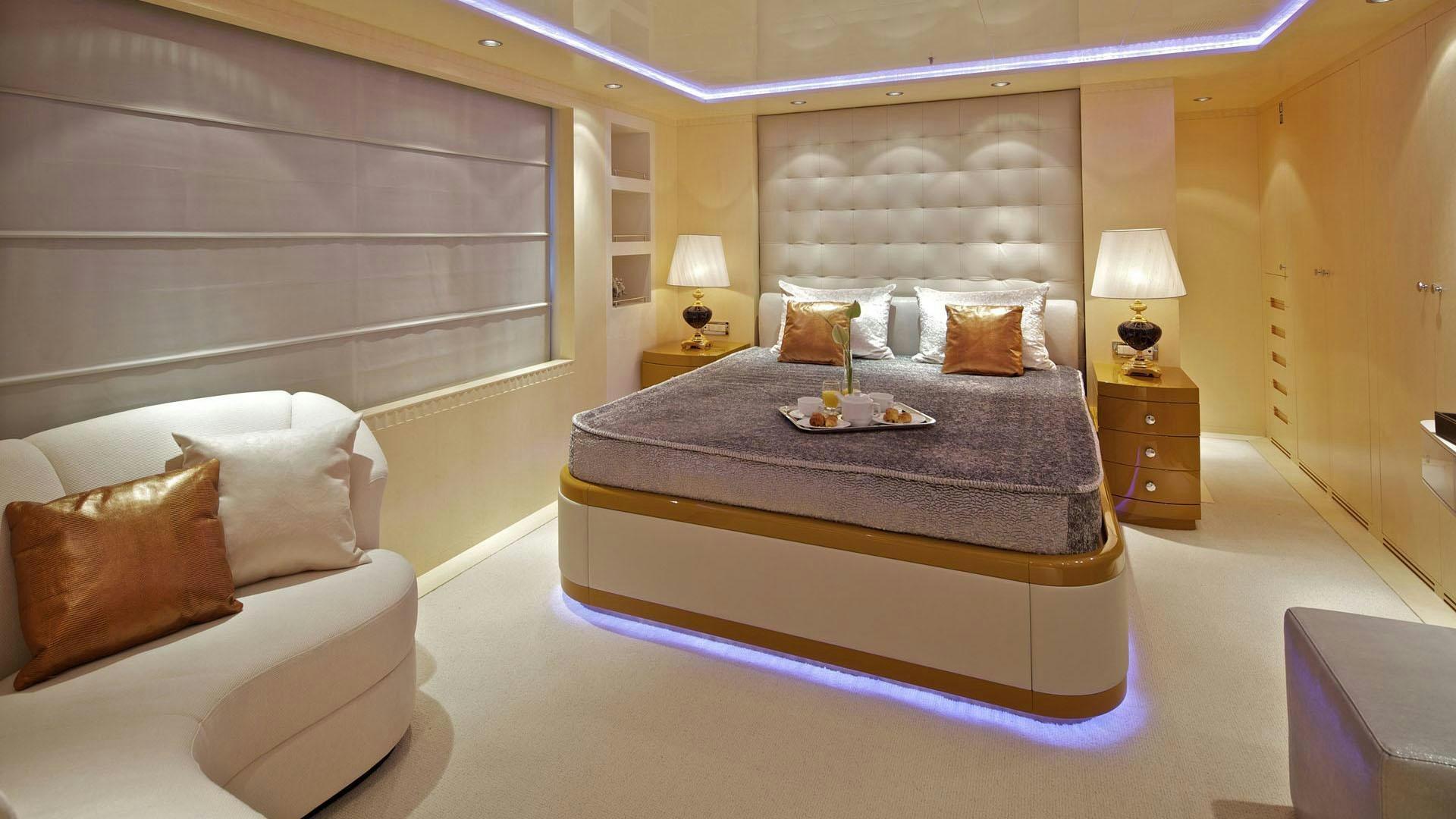 a large bedroom with a large bed aboard MIA RAMA Yacht for Charter