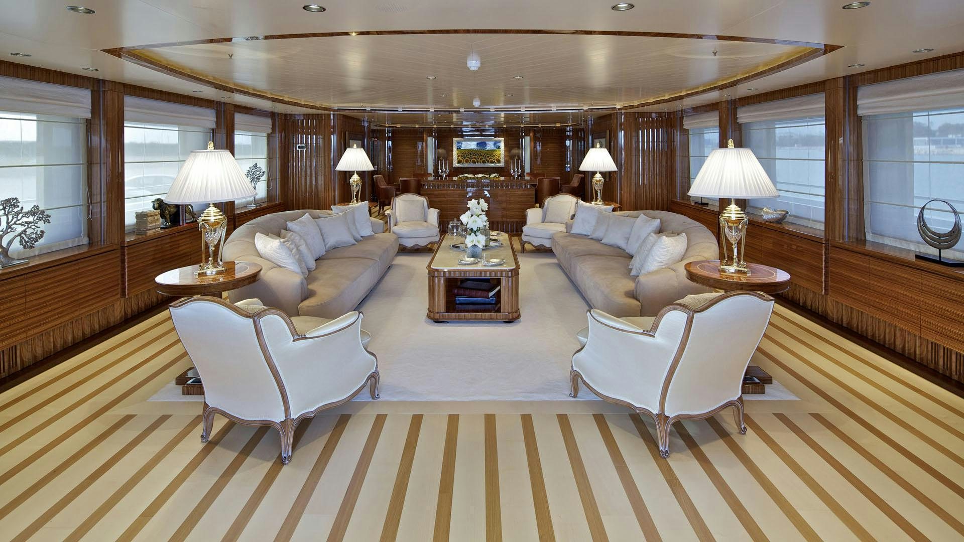 a living room with a large mirror aboard MIA RAMA Yacht for Charter