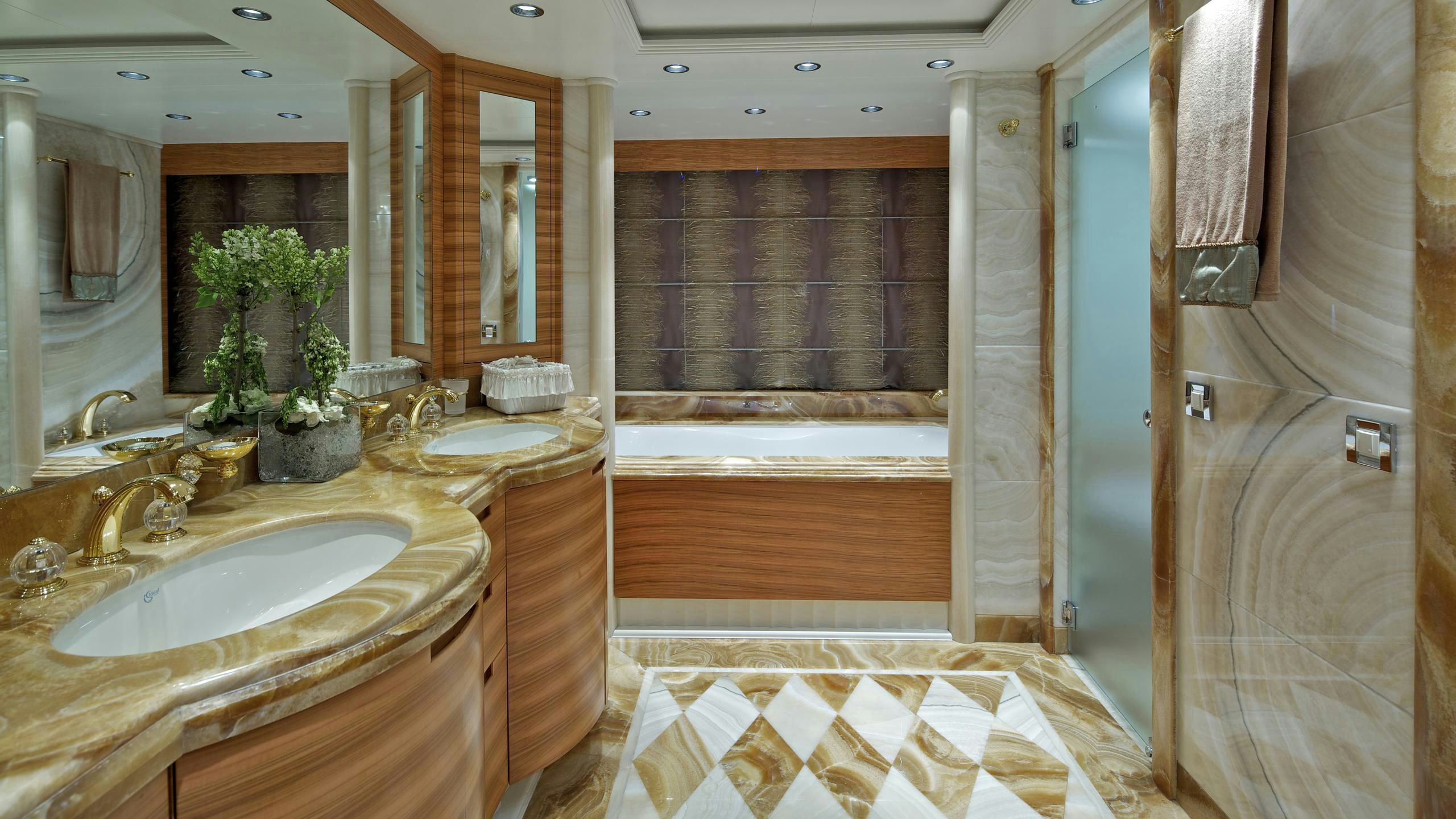 a bathroom with a sink and a bathtub aboard MIA RAMA Yacht for Charter
