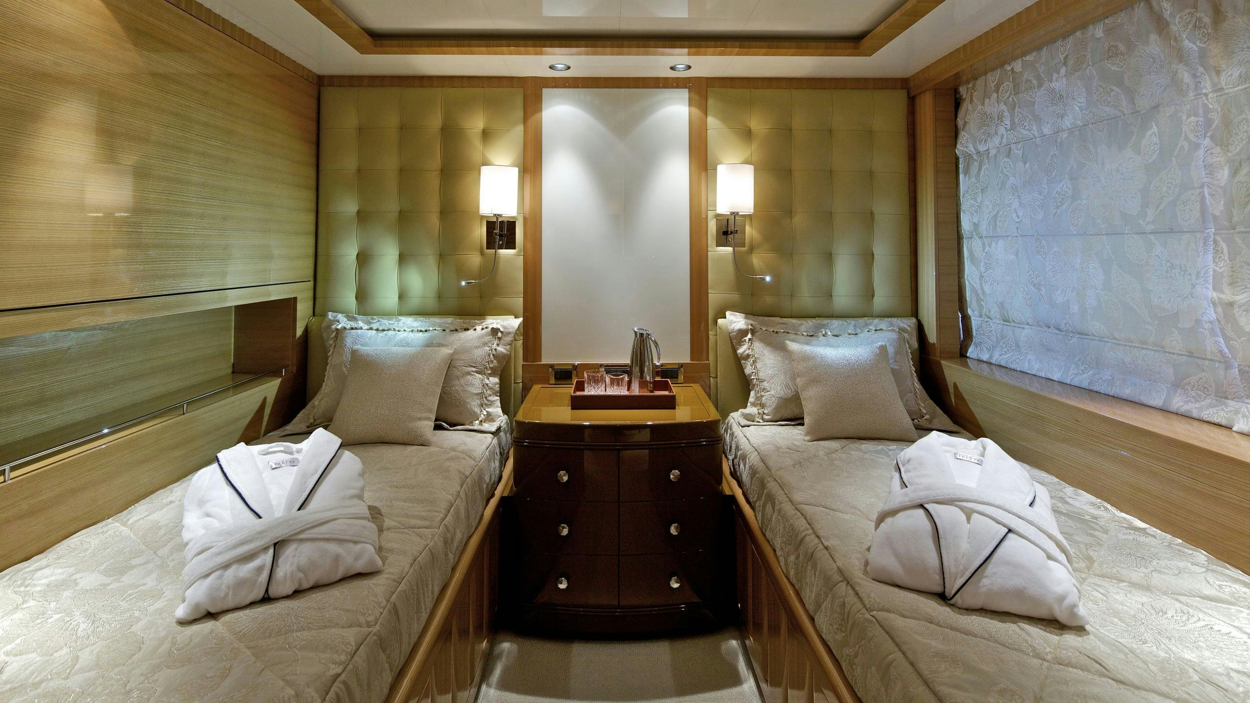 a room with a bed and a mirror aboard MIA RAMA Yacht for Charter