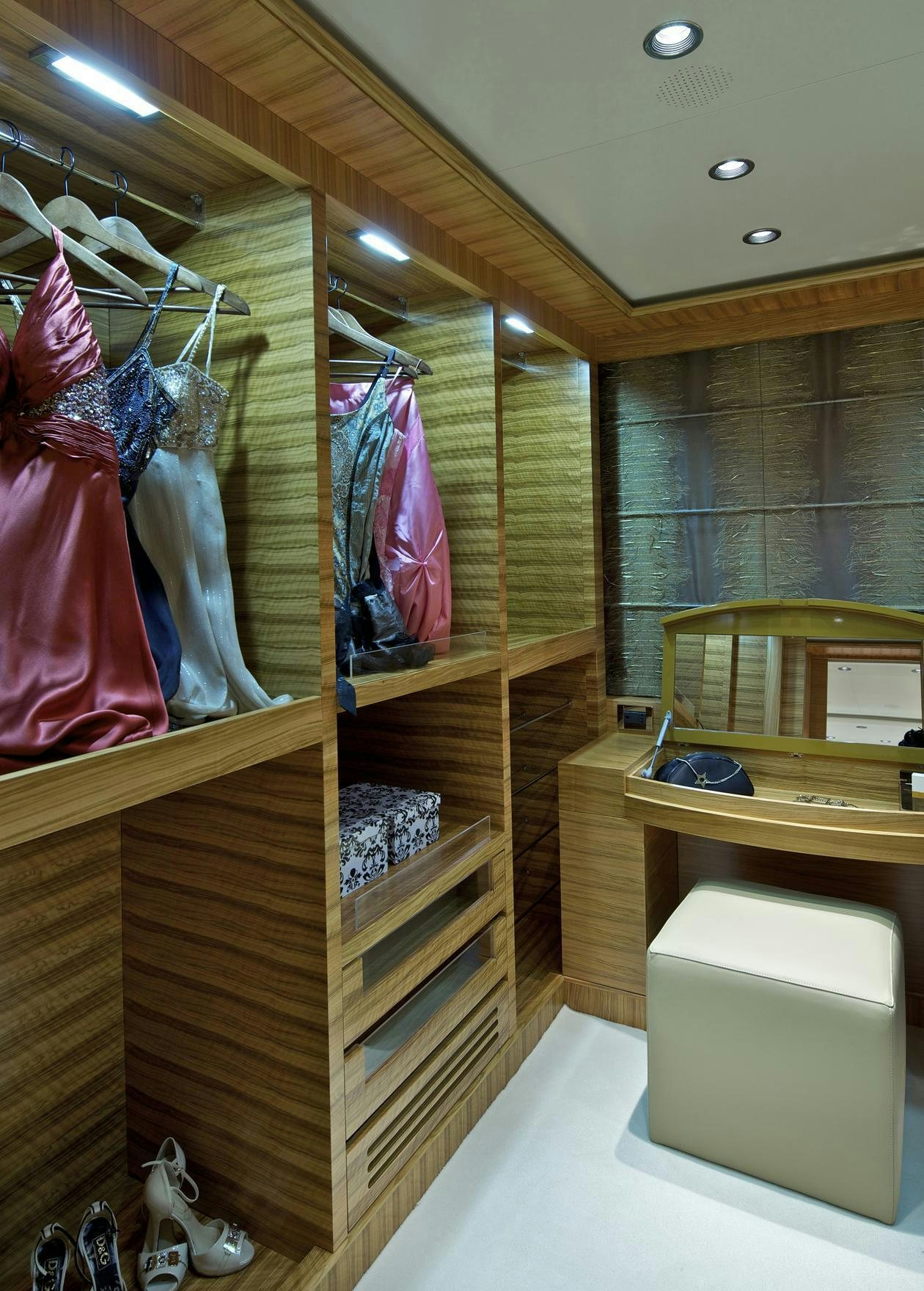 a closet with clothes on the wall aboard MIA RAMA Yacht for Charter