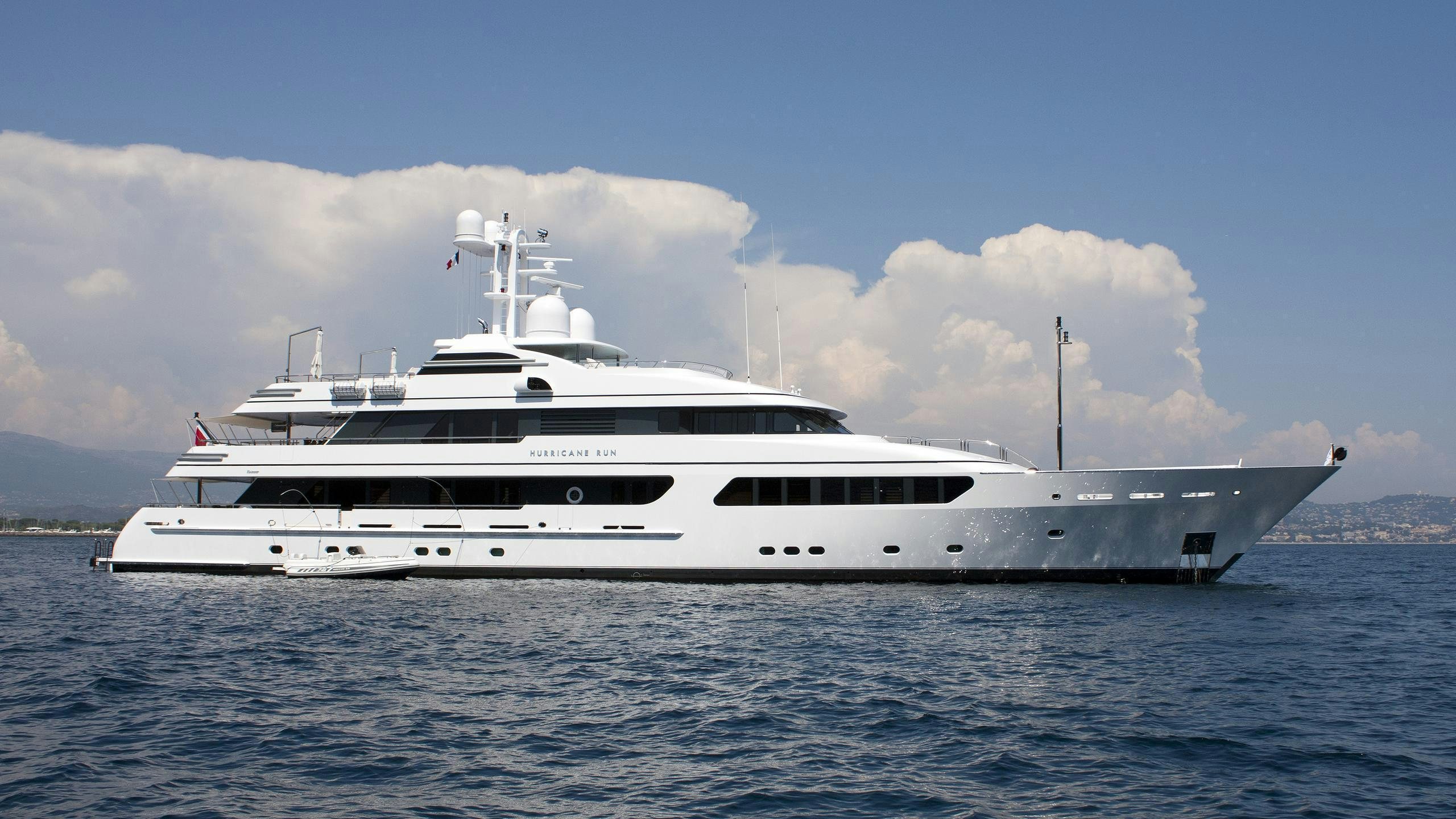 a large white boat in the water aboard HURRICANE RUN Yacht for Charter