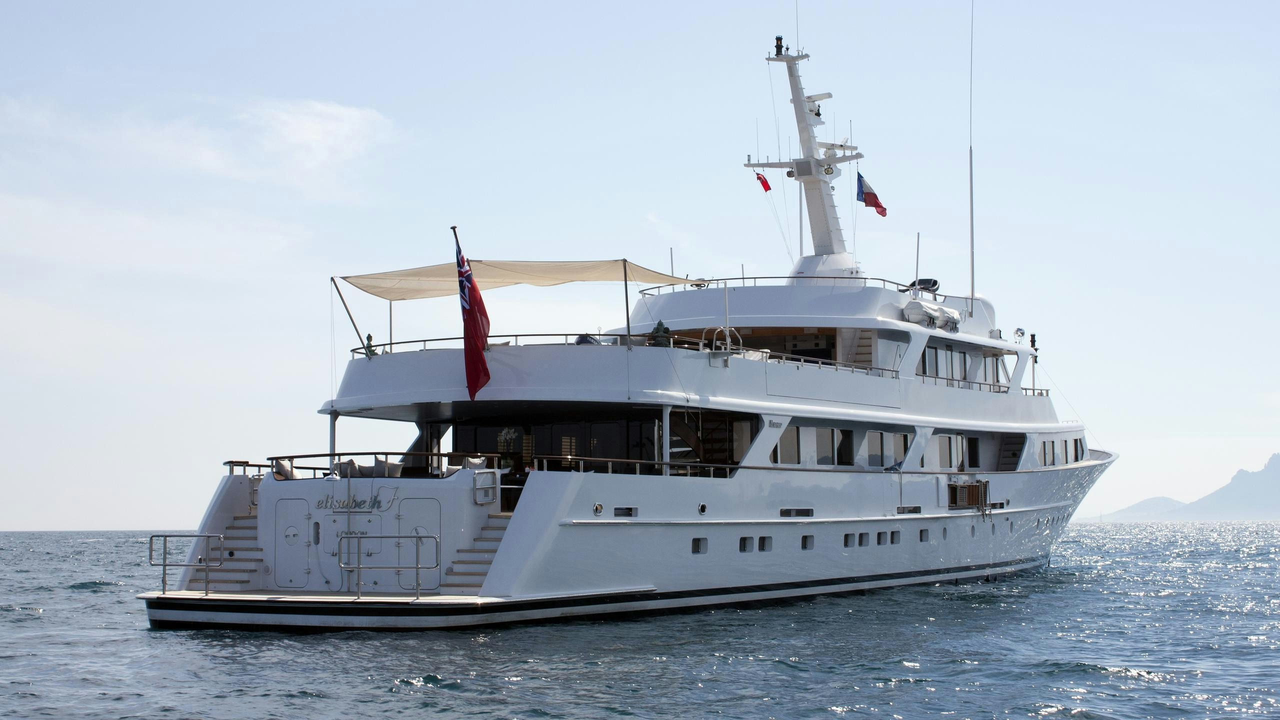 a large white boat in the water aboard MIRAGE Yacht for Charter