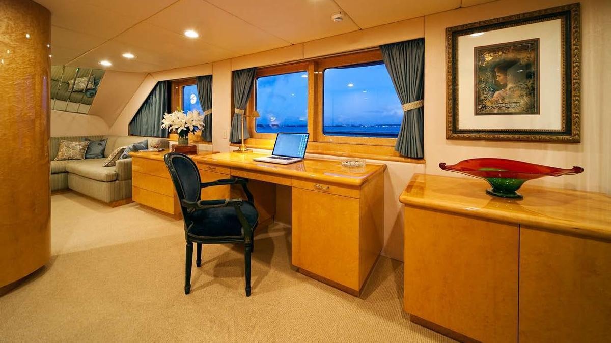a room with a desk and a chair aboard BIG EAGLE Yacht for Charter