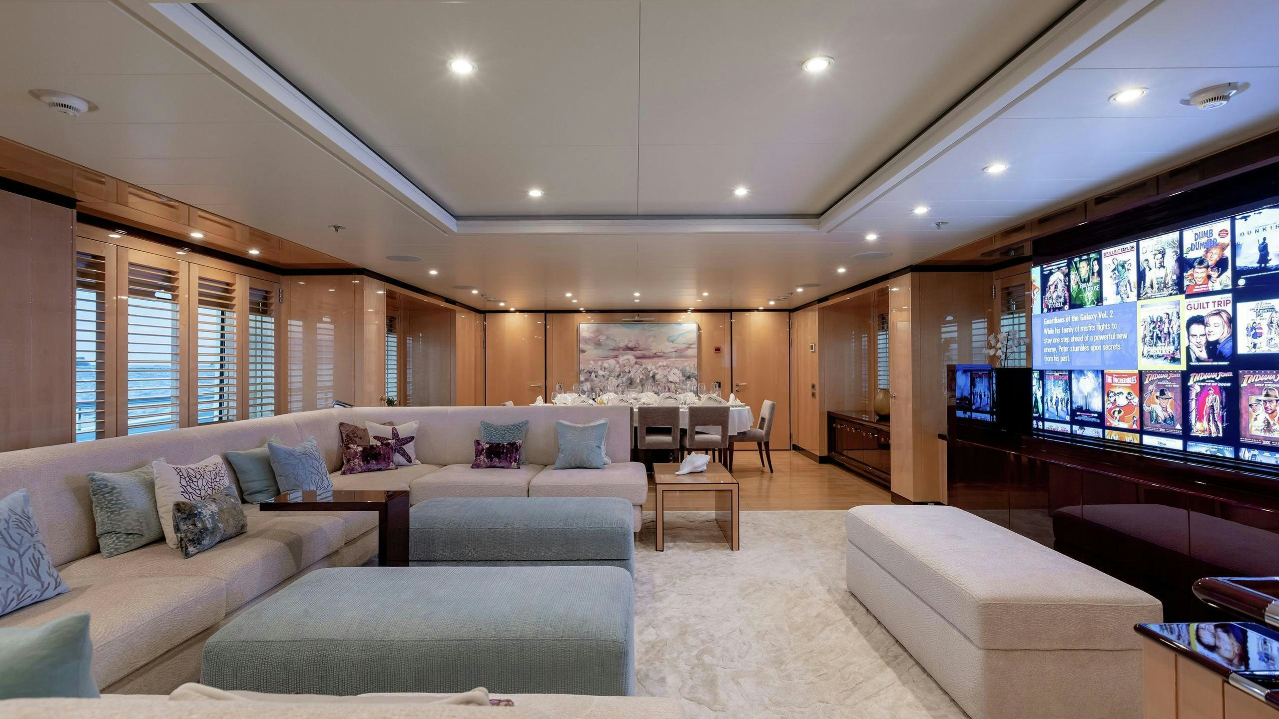 a living room with a large window aboard LA MIRAGE Yacht for Charter