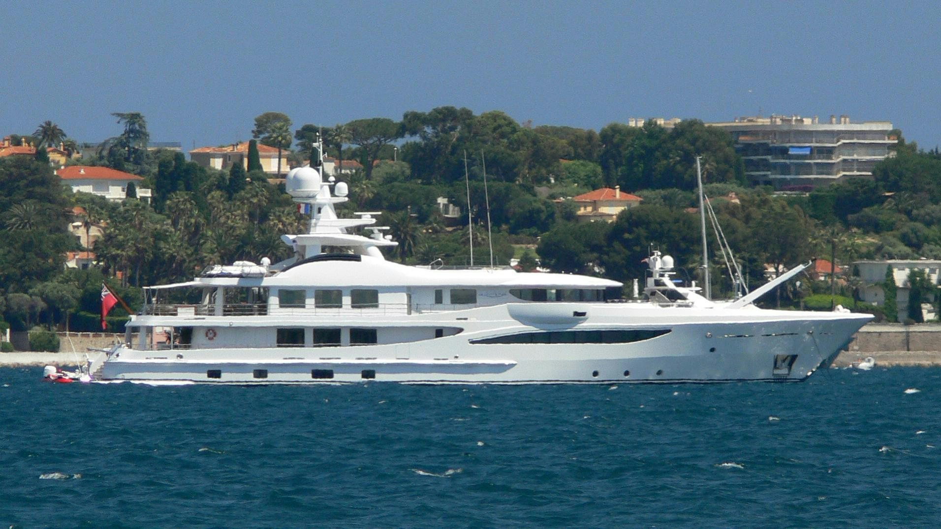 a large white boat in the water aboard LA MIRAGE Yacht for Charter