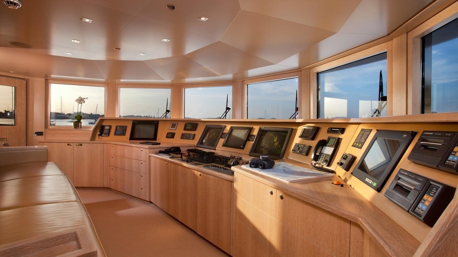 a kitchen with wooden cabinets aboard FRIENDSHIP Yacht for Charter