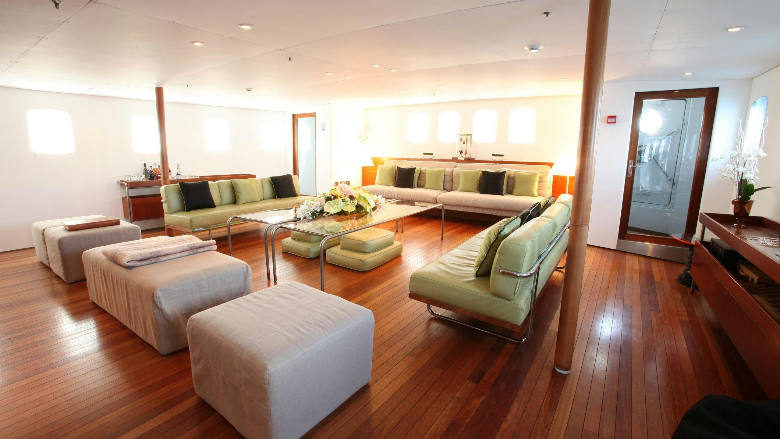 a living room with a couch and a table aboard DIONEA Yacht for Charter