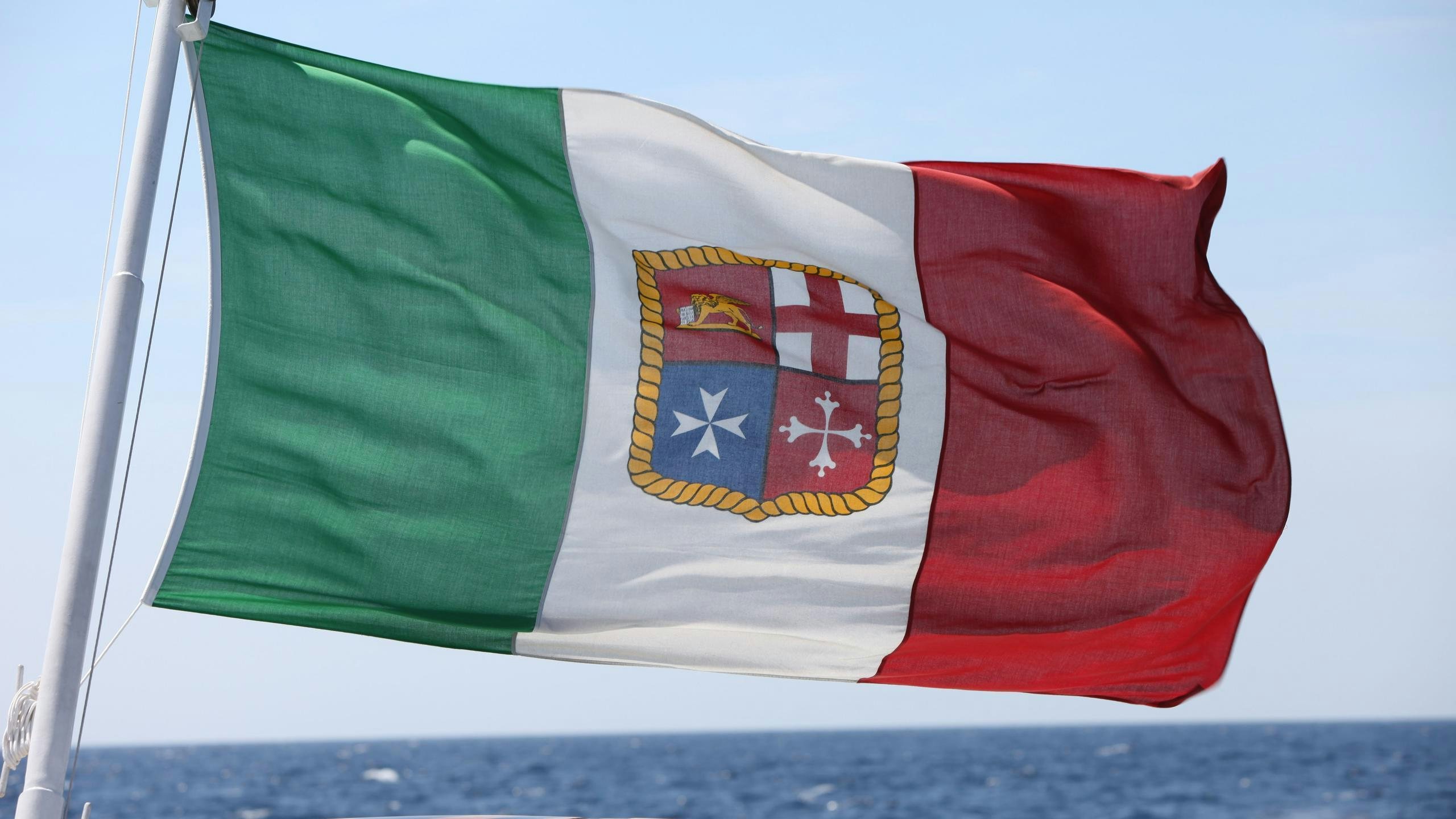 a flag on a pole aboard DIONEA Yacht for Charter