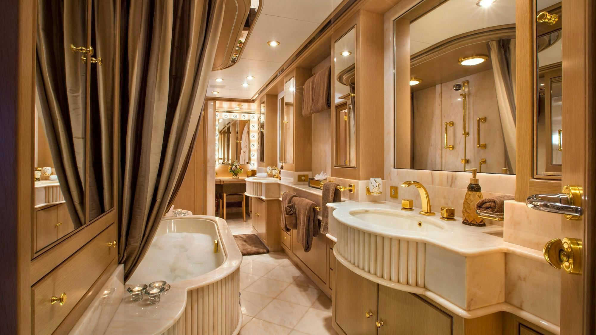 a bathroom with a bathtub and a sink aboard CHANTAL MA VIE Yacht for Charter