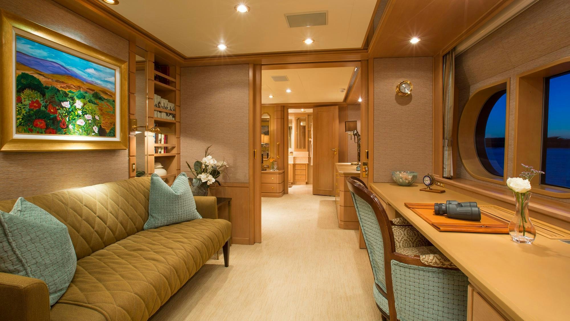 a living room with a couch and a table aboard CHANTAL MA VIE Yacht for Charter