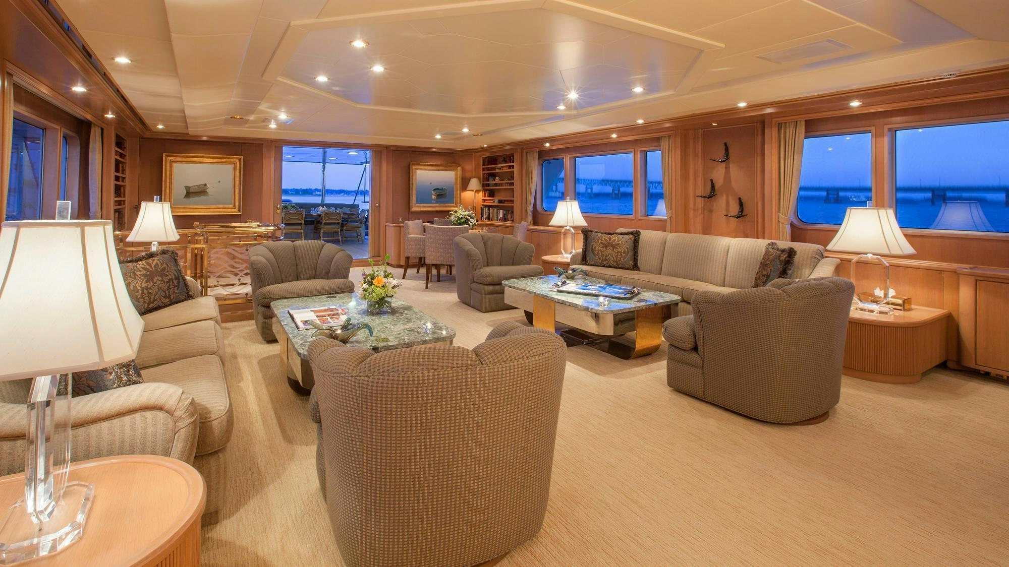 a living room with a large window aboard CHANTAL MA VIE Yacht for Charter