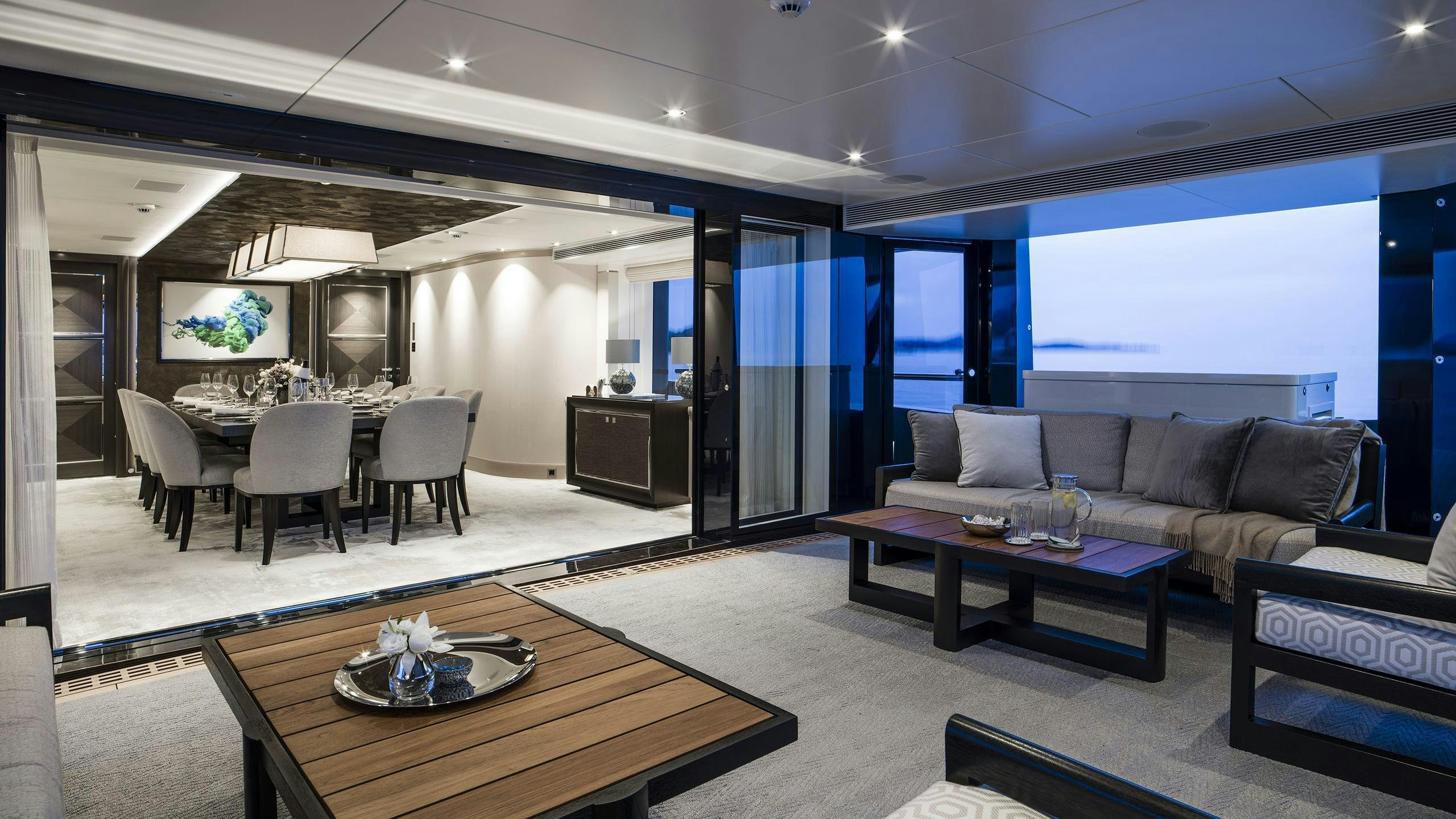 a living room with a couch and a table aboard IRISHA Yacht for Charter
