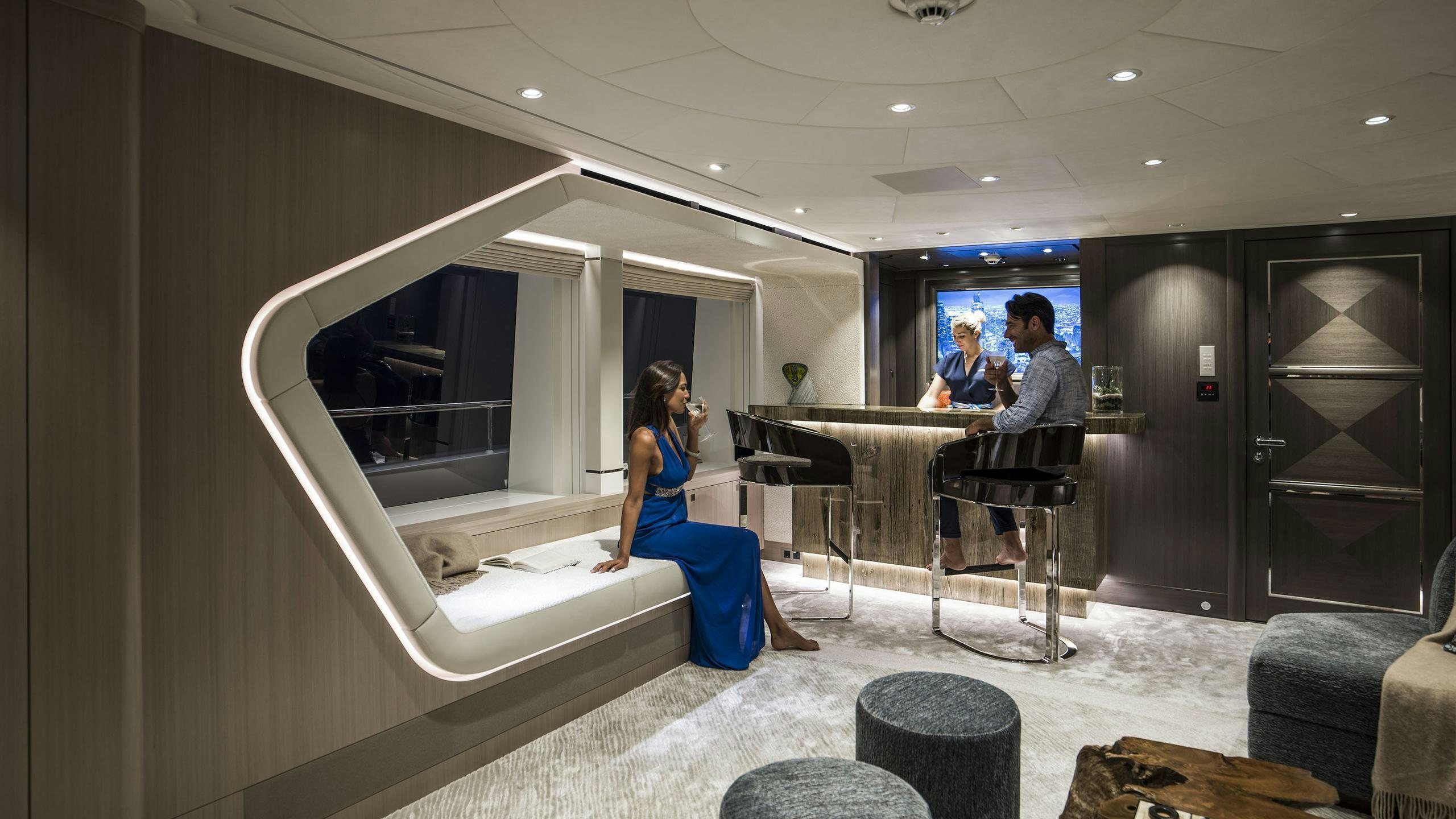 a group of people in a room aboard IRISHA Yacht for Charter