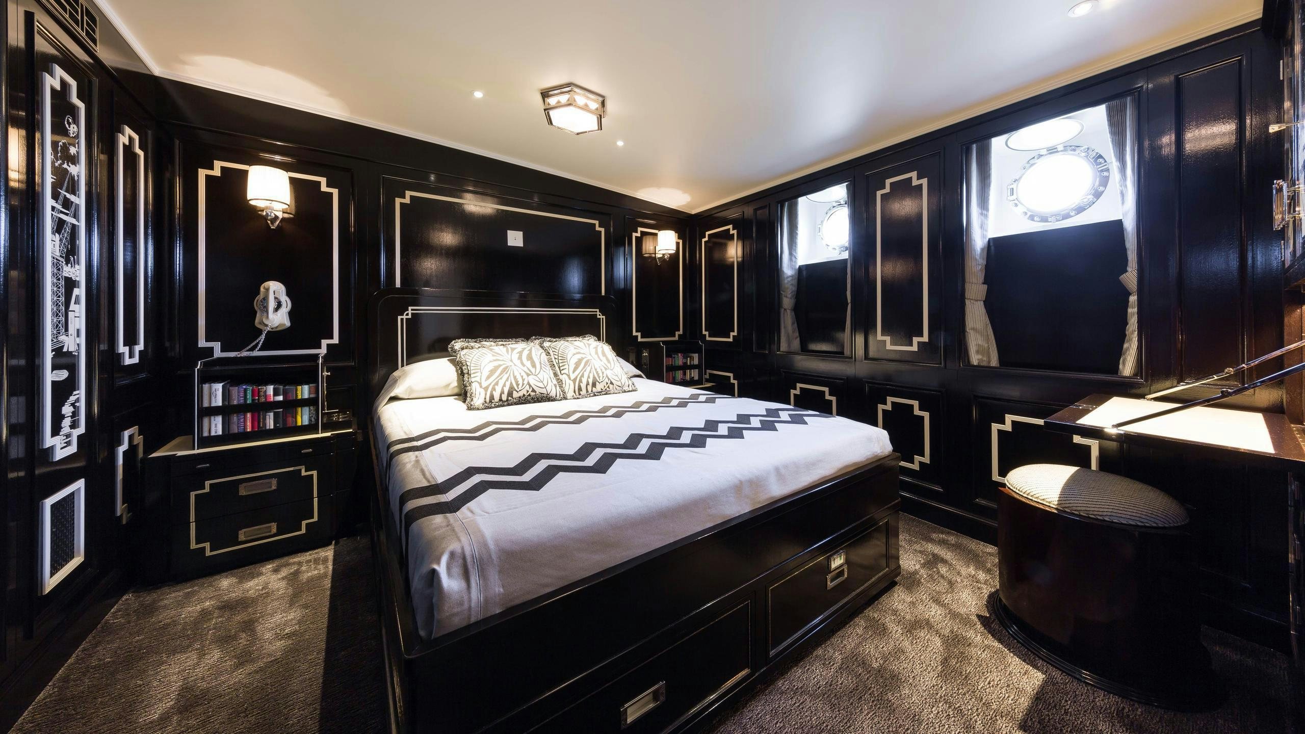 a bedroom with a large bed aboard MALAHNE Yacht for Charter