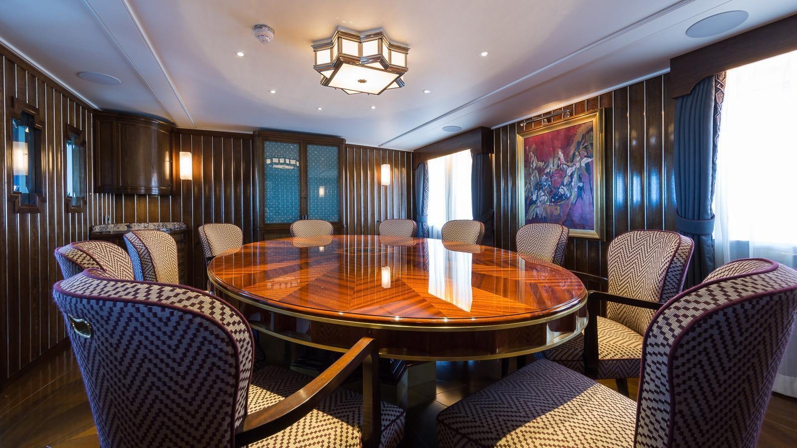 a dining room with chairs and a table aboard MALAHNE Yacht for Charter