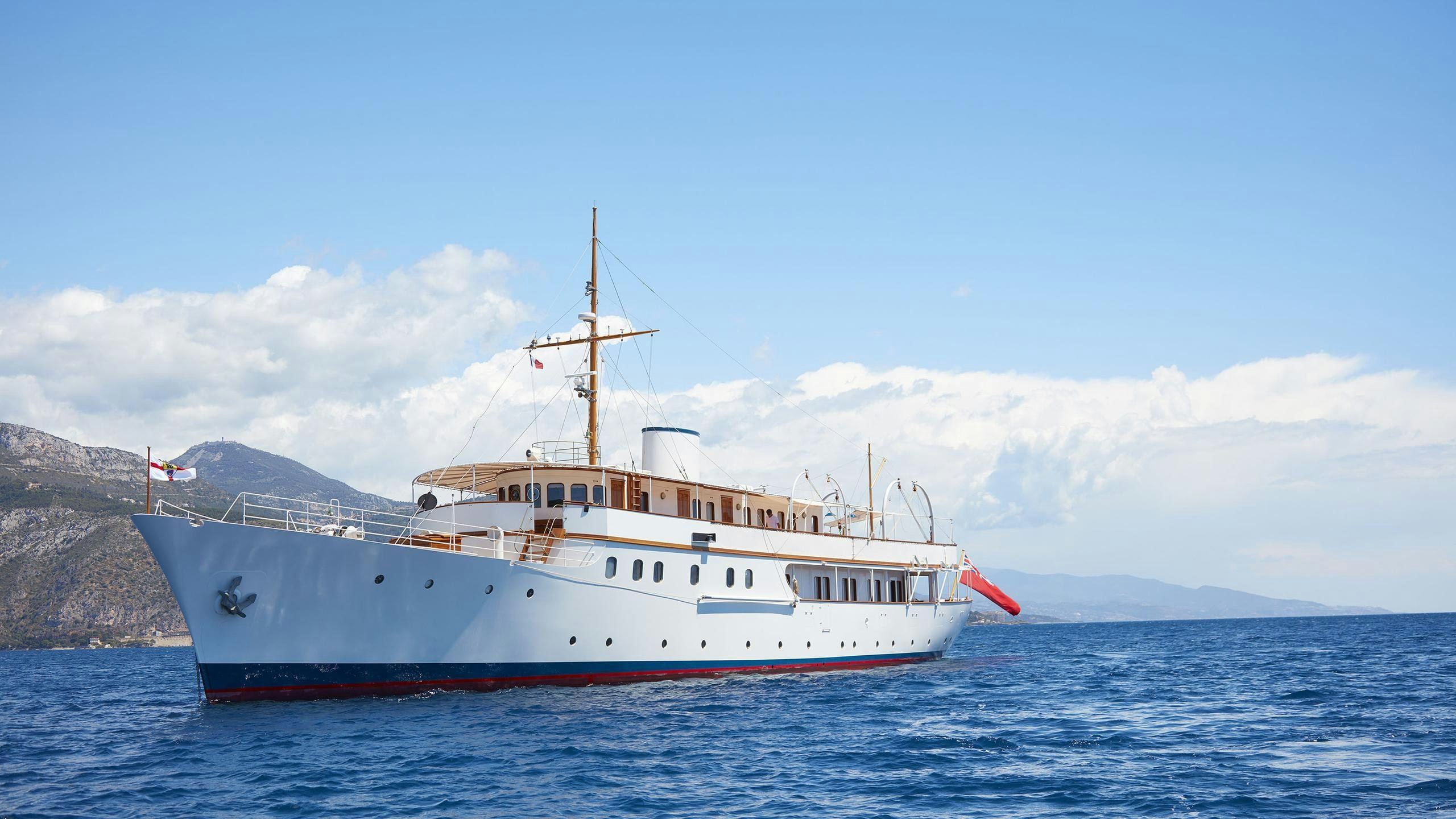 a large white boat in the water aboard MALAHNE Yacht for Charter