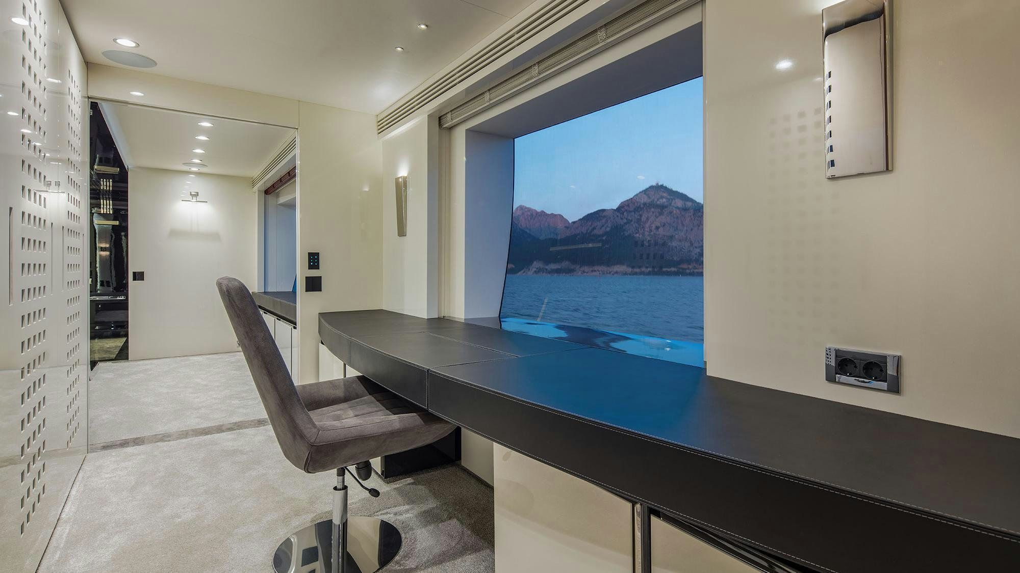 a room with a table and chairs aboard EUPHORIA II Yacht for Charter