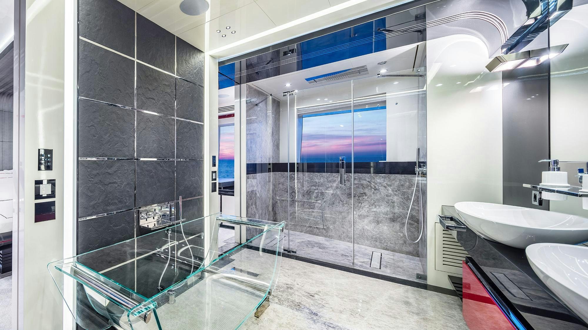 a bathroom with a glass shower aboard EUPHORIA II Yacht for Charter