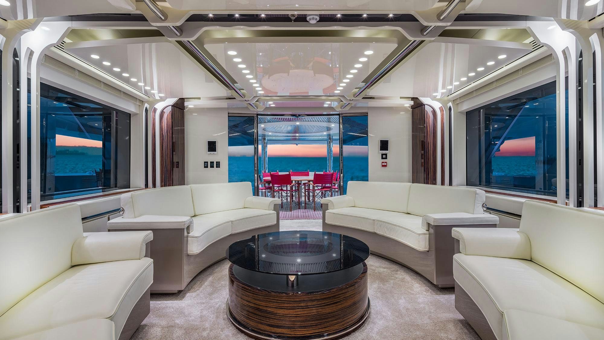 a room with a table and couches aboard EUPHORIA II Yacht for Charter